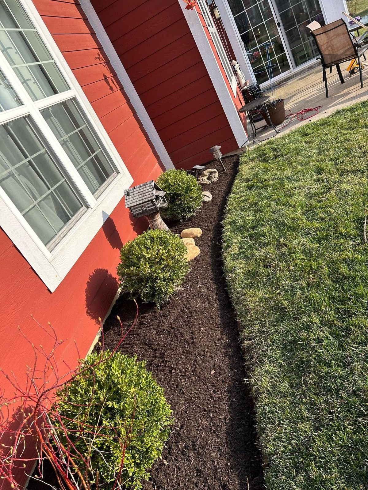 Landscape bed pathway with bushes